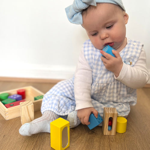  baby playing with the discovery blocks