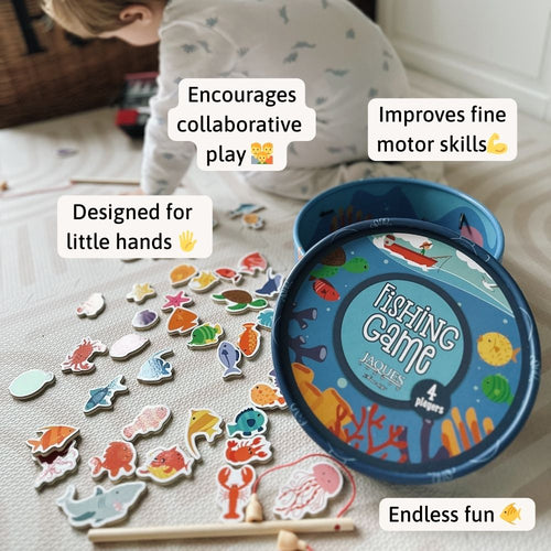 Children's fishing game with colorful fish pieces and a blue tin labeled 'Fishing Game Jaques'. 