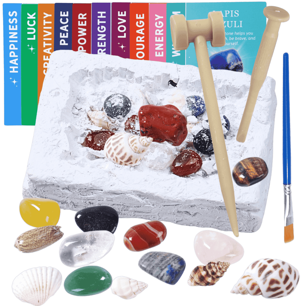 Decorative stone with seashells, stones, and a brush on a black background