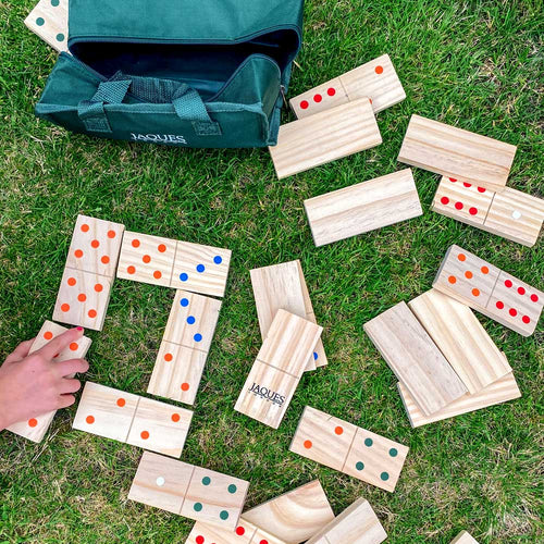 Children playing with the dominoes together 