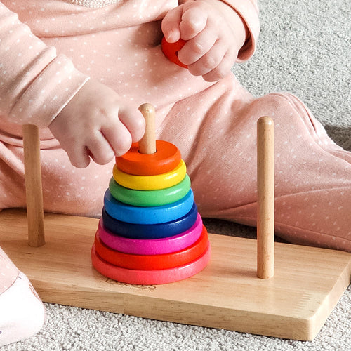 Child playing with tower of Hanoi 
