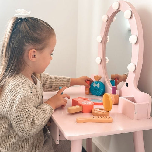  Girl using wooden make up set