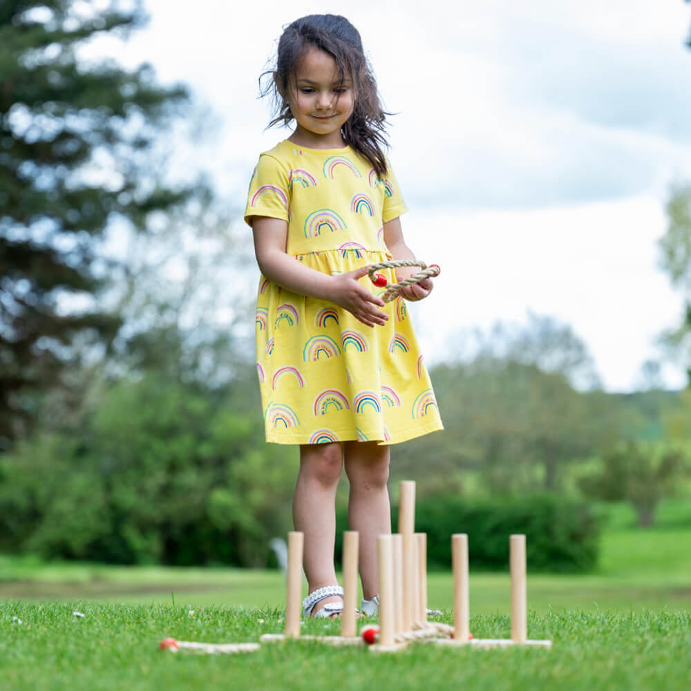  Image of girl about throw a Quoit onto the board in garden