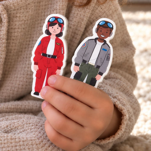 A child holding two bi-plane pilots. 