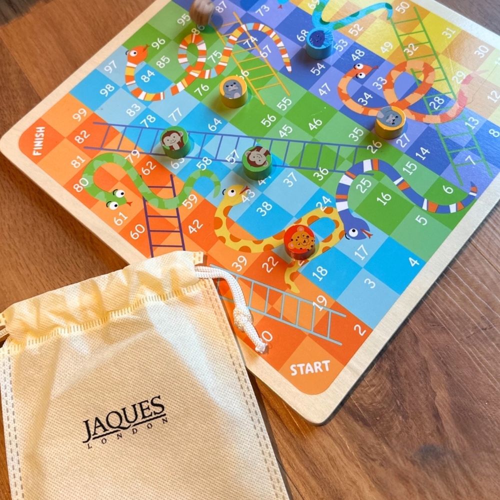  Snakes and Ladders boardgame with Jaques branded counter bag next to it