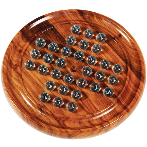  an image looking down at the brown solitaire board with clear balls.