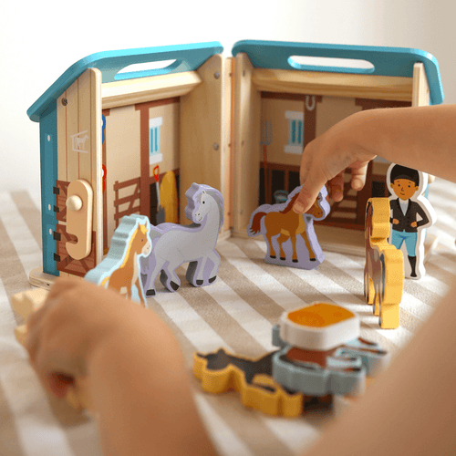  Child playing with Wooden Horse Characters