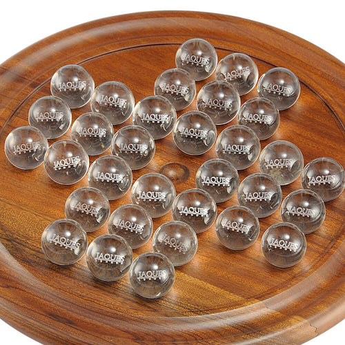  zoomed in image of brown solitaire board and clear balls with Jaques London written on them 