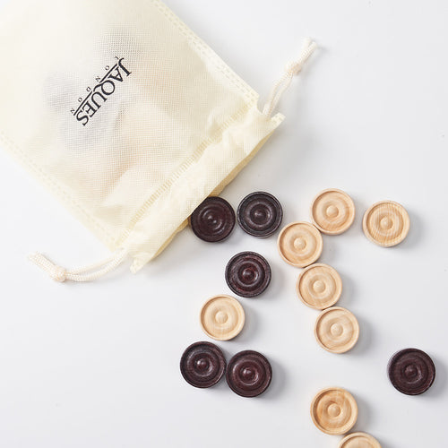 Wooden draughts pieces falling out of drawstring bag  