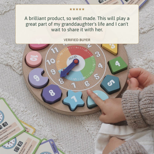 Toddler with the Jaques wooden teaching clock, five star review a brilliant product 