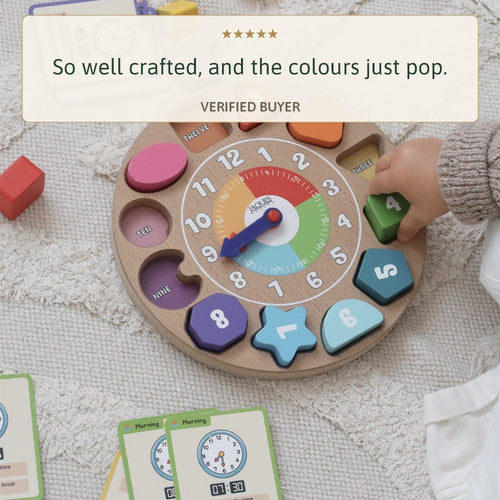 Childs hand on the Jaques wooden clock, five star review so well crafted colours pop 