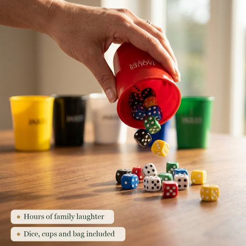 Coloured dice tumbling from a Jaques Liars Dice cup 