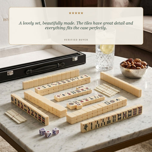 Jaques of London Mahjong tiles laid out on a marble table with a five star customer review 