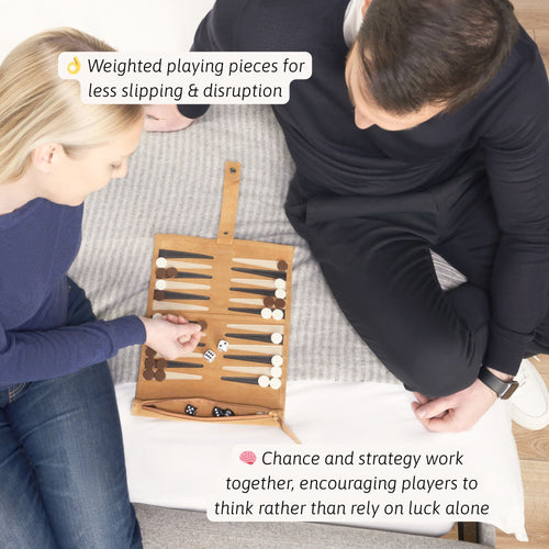 Two people playing a board game with a focus on weighted pieces and strategy. 