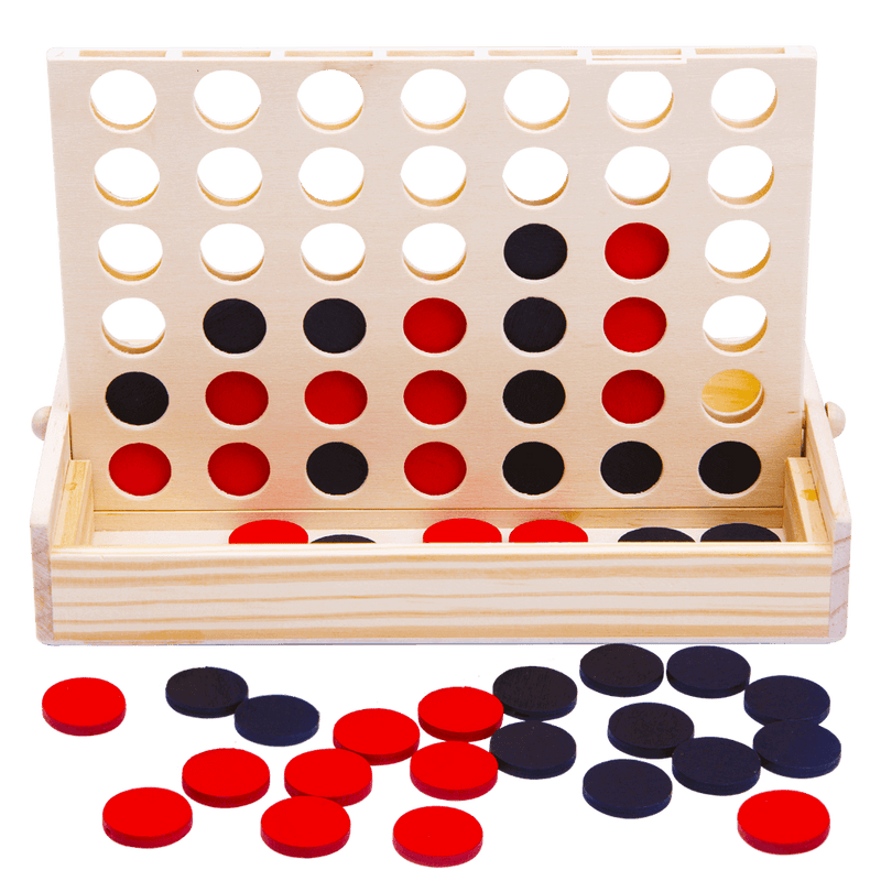 Four in a row wooden family game. Four in a row game in play with some red and black counters in