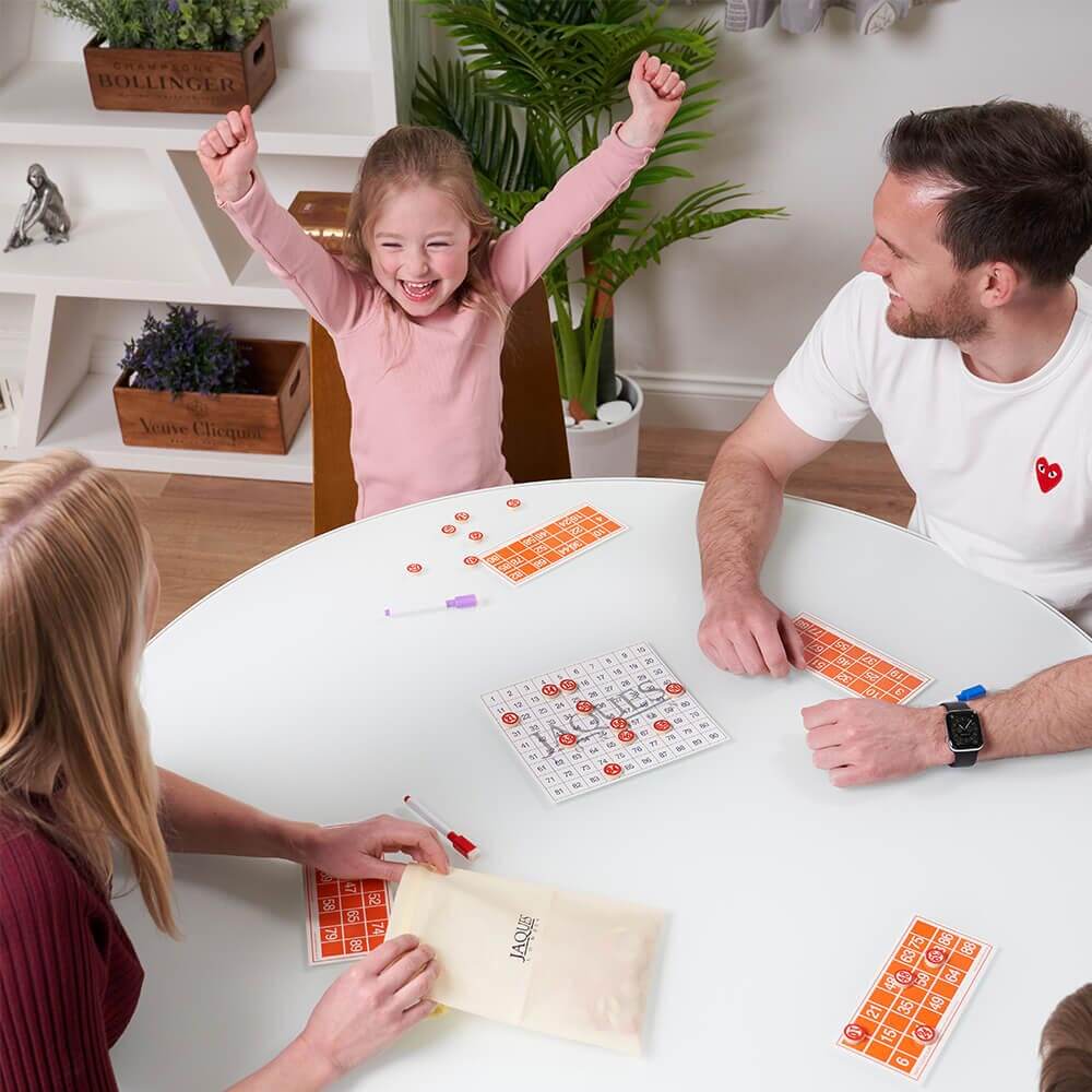  Child celebrating winning bingo game with family
