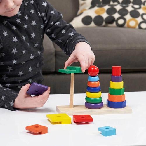  Child using wooden colour stacker