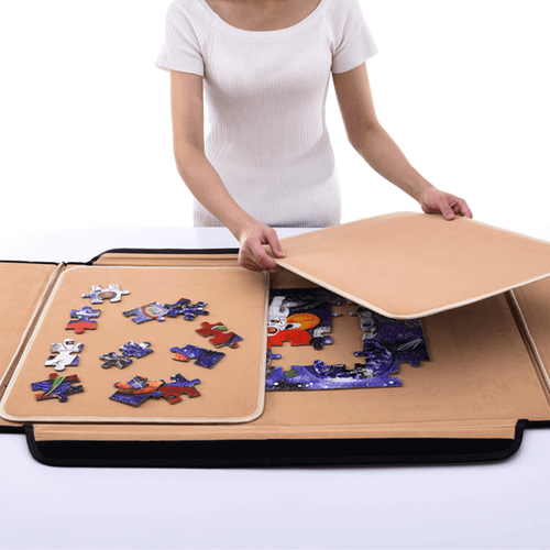 Portable jigsaw puzzle board - lady laying puzzle mat to cover jigsaw   