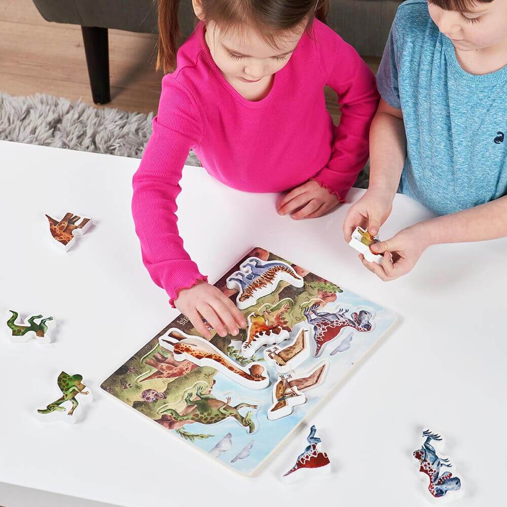 Children putting dinosaur puzzles together