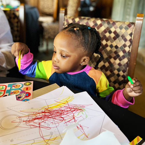  Girl colouring with easy clean art crayons 