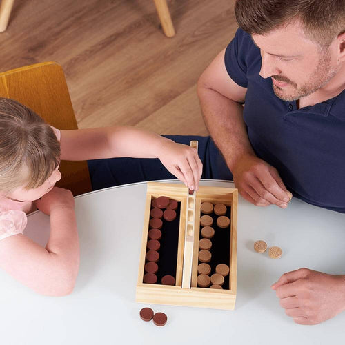  Child playing four in a row with parent 