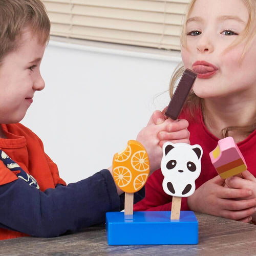  Children pretending to lick holiday lolly play food