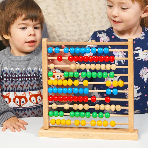  Boy and girl playing with their abacus