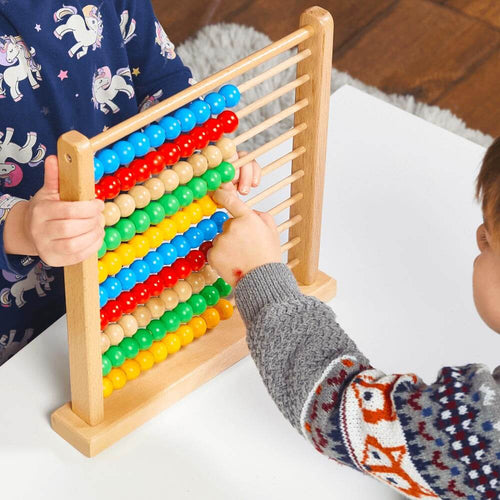  Kids Wooden Abacus-Boy pointing at yellow abacus bead-80527. 