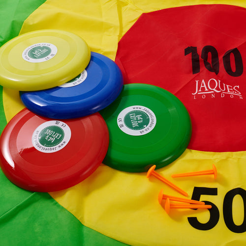 Close up of target toss game, target mat, Frisbees and pegs 