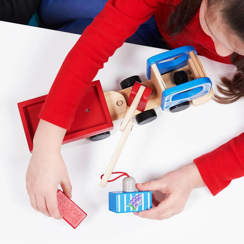   Child playing with magnetic crane truck 