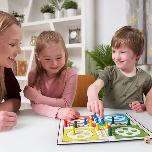  Children playing ludo board game with Mum
