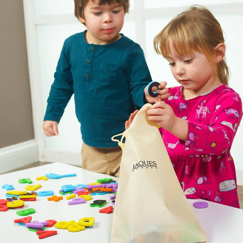 Foam magnetic letters and numbers game - a girl and boy putting the letters into the storage bag