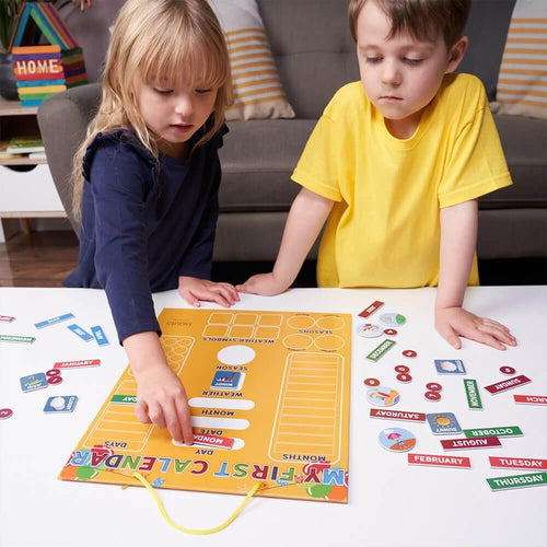 Children placing magnets on my first magnetic calendar 