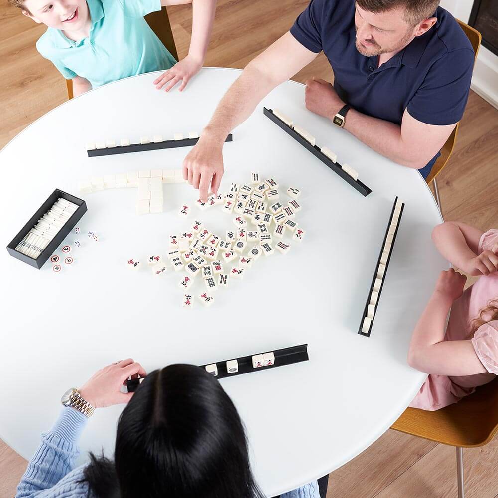 Family playing mah jongg 