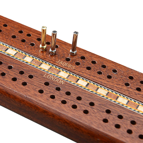  Mahogany cribbage board with metal pins close up 