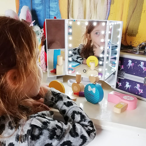  Girl using wooden make up set