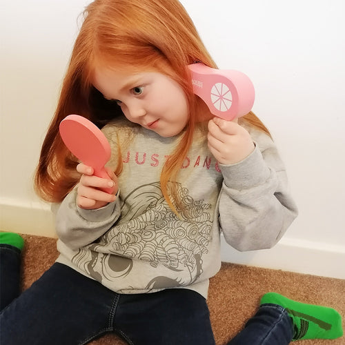  Girl using wooden hair dryer and mirror 