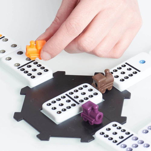  Traditional board game-Mexican train dominoes-Close up of hand holding train-56136es 