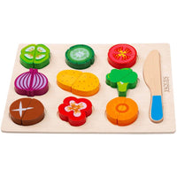 Pretend vegetable board with magnetic pieces and a wooden knife