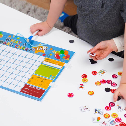  Children choosing magnets for what a star reward chart