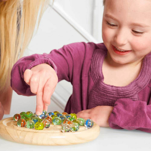 Girl holding marble whilst making her move 